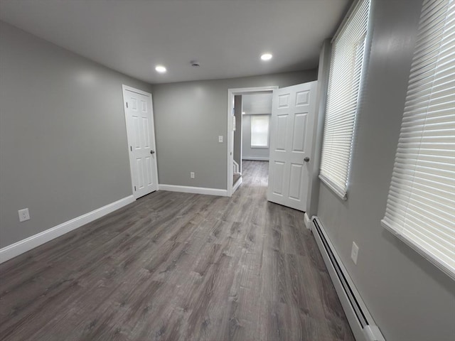 103 Pleasent, Woonsocket, RI 02895 - spare room with dark wood-style floors, recessed lighting, baseboards, and a baseboard radiator