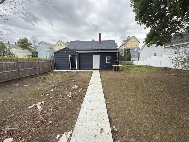 103 Pleasent, Woonsocket, RI 02895 - rear view of property with a fenced backyard and a residential view