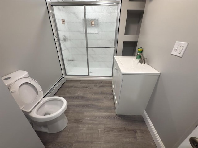 103 Pleasent, Woonsocket, RI 02895 - full bathroom with a baseboard heating unit, toilet, a stall shower, vanity, and wood finished floors