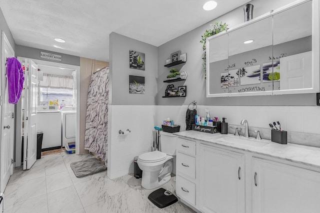 full bathroom with recessed lighting, marble finish floor, toilet, vanity, and separate washer and dryer