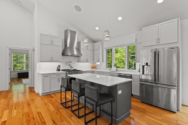751 Sharps Lot Rd, Swansea, MA 02777 - kitchen featuring stainless steel appliances, wall chimney exhaust hood, light countertops, decorative backsplash, and recessed lighting
