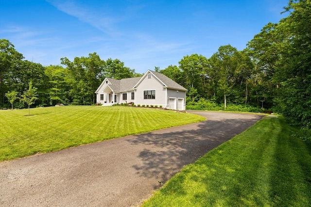 751 Sharps Lot Rd, Swansea, MA 02777 - view of front of property featuring asphalt driveway, a garage, and a front yard