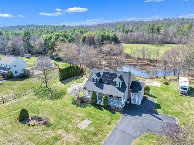 bird's eye view with a forest view and a water view