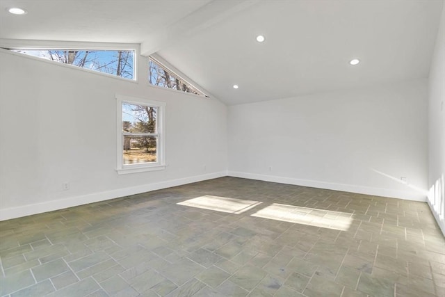 spare room featuring beam ceiling and high vaulted ceiling