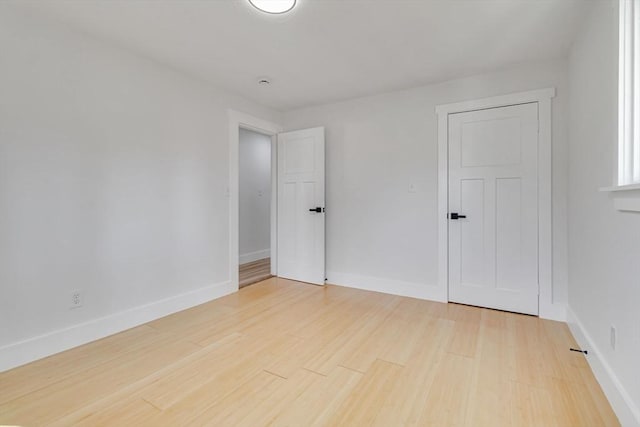 unfurnished room featuring wood-type flooring