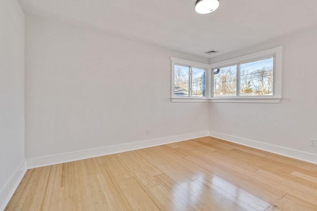 empty room featuring hardwood / wood-style flooring