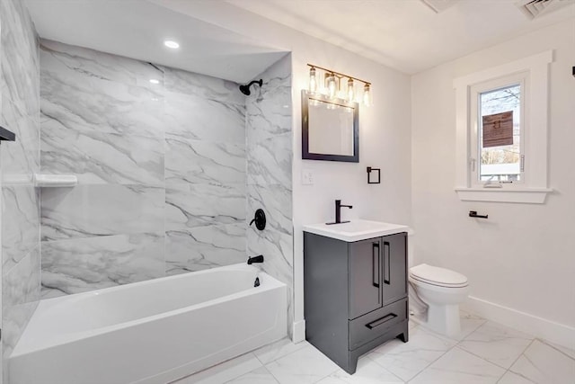 full bathroom featuring toilet, vanity, and tiled shower / bath