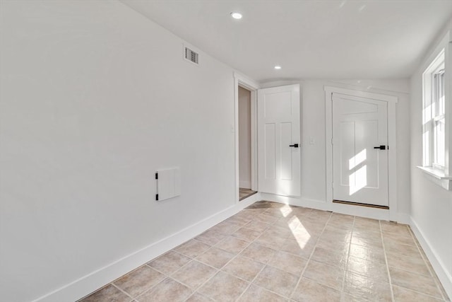 empty room with lofted ceiling