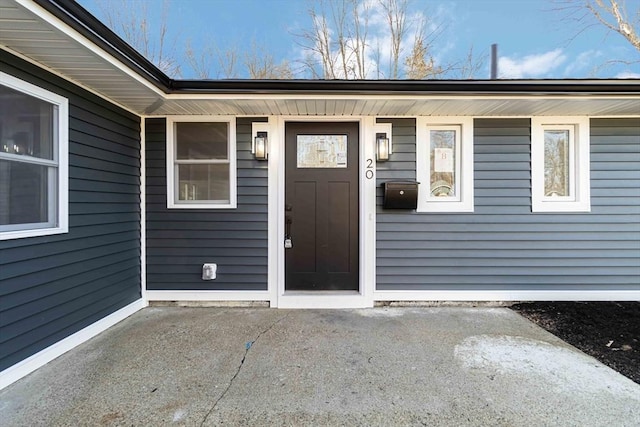 property entrance featuring a patio area