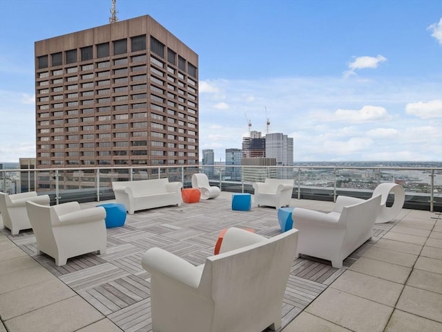 view of patio with an outdoor hangout area and a view of city