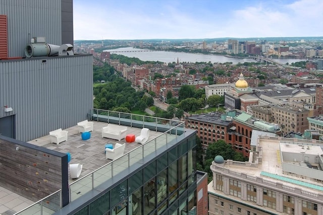 balcony featuring a view of city and a water view