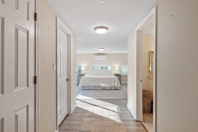 558 Amesbury Rd, Haverhill, MA 01830 - bedroom featuring light wood-style floors and a wall mounted AC