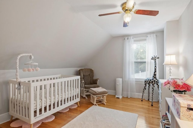 558 Amesbury Rd, Haverhill, MA 01830 - bedroom with wood finished floors, vaulted ceiling, ceiling fan, and a crib
