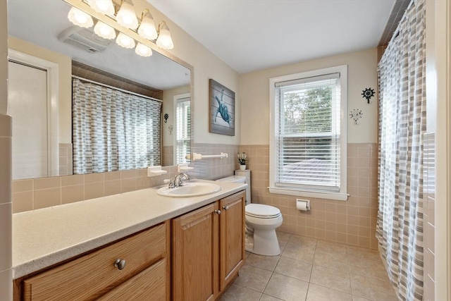 558 Amesbury Rd, Haverhill, MA 01830 - full bath with tile walls, vanity, tile patterned floors, a wainscoted wall, and a shower with shower curtain