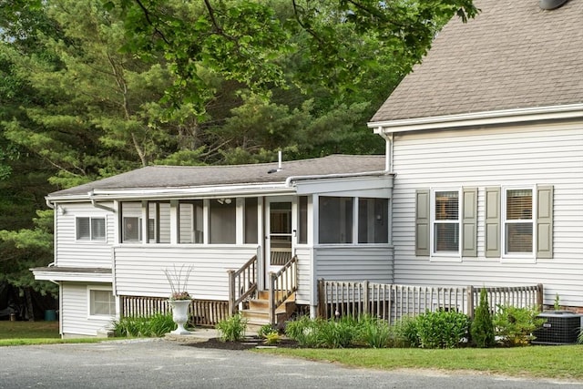558 Amesbury Rd, Haverhill, MA 01830 - view of front of house with roof with shingles and a sunroom
