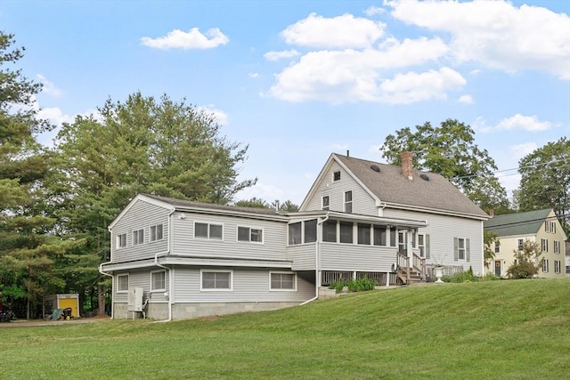 558 Amesbury Rd, Haverhill, MA 01830 - back of property featuring a sunroom and a yard