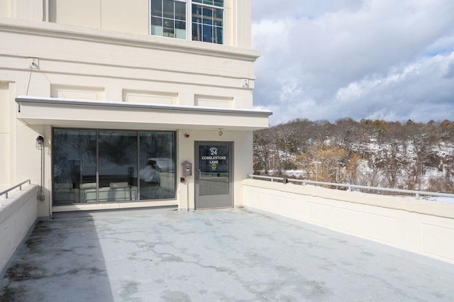 view of snow covered property entrance