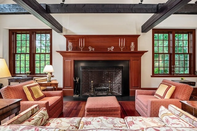 4 Dexter Ln, Manchester, MA 01944 - sitting room with dark wood-style flooring, a fireplace with flush hearth, and beam ceiling