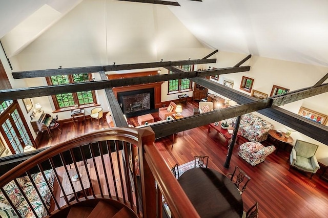 4 Dexter Ln, Manchester, MA 01944 - stairway with wood finished floors, high vaulted ceiling, and a fireplace