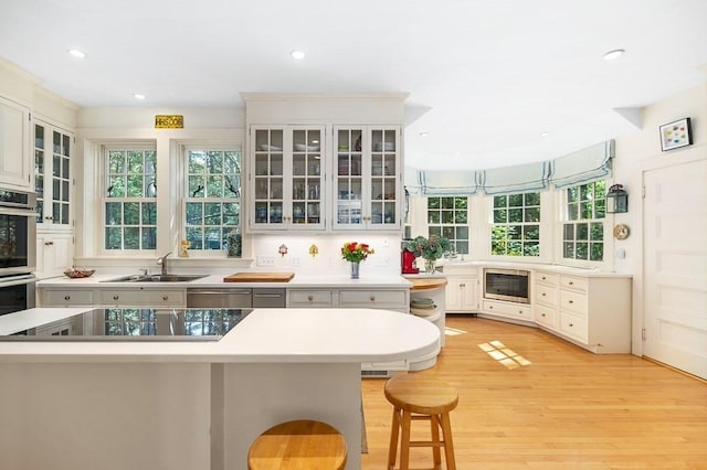 4 Dexter Ln, Manchester, MA 01944 - kitchen featuring a sink, healthy amount of natural light, recessed lighting, appliances with stainless steel finishes, and light wood-style floors