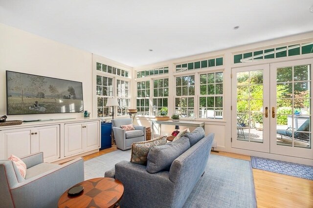 4 Dexter Ln, Manchester, MA 01944 - living area featuring french doors and light wood finished floors
