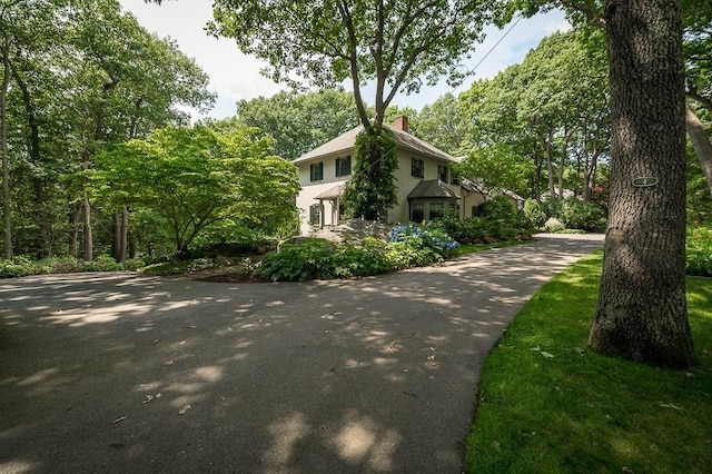 4 Dexter Ln, Manchester, MA 01944 - view of property exterior with a chimney and stucco siding