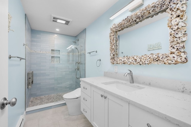 bathroom with tile patterned floors, a shower with door, vanity, and toilet