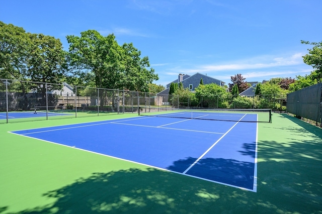 view of tennis court with basketball court