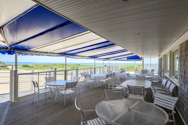 wooden deck featuring a water view