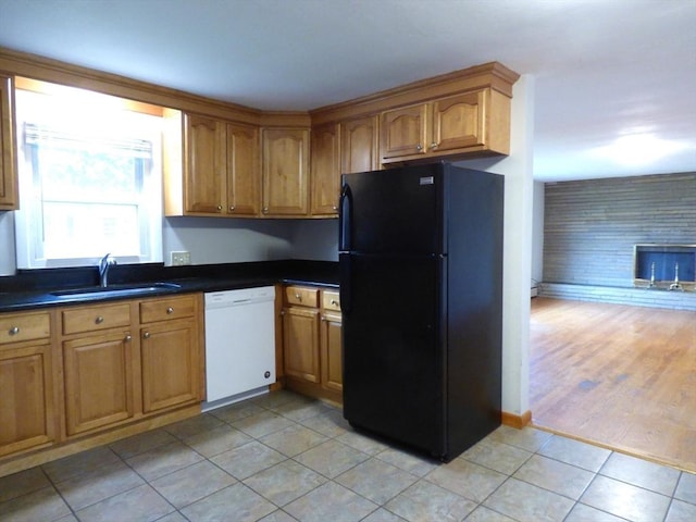 25 Williams St, Ludlow, MA 01056 - kitchen featuring dishwasher, freestanding refrigerator, a sink, and dark countertops