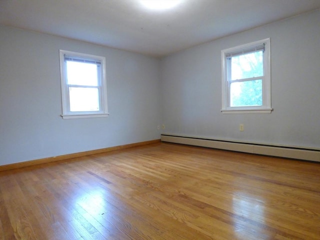 25 Williams St, Ludlow, MA 01056 - spare room with plenty of natural light, light wood-type flooring, a baseboard heating unit, and baseboards