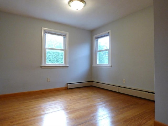 25 Williams St, Ludlow, MA 01056 - spare room featuring wood finished floors, a baseboard radiator, and baseboards