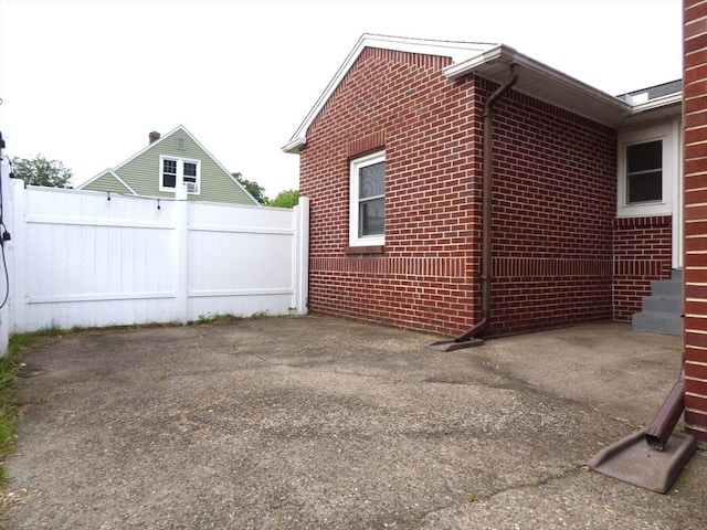 25 Williams St, Ludlow, MA 01056 - view of side of home featuring brick siding