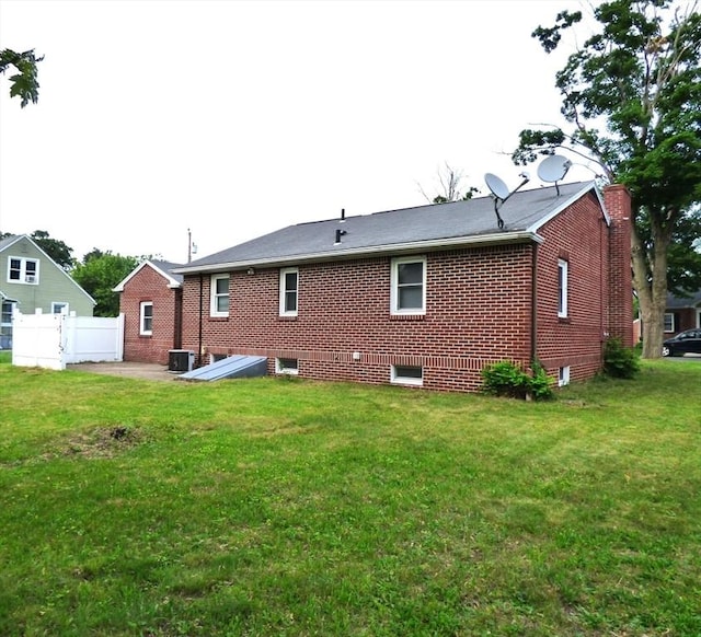 25 Williams St, Ludlow, MA 01056 - back of property with central AC and brick siding