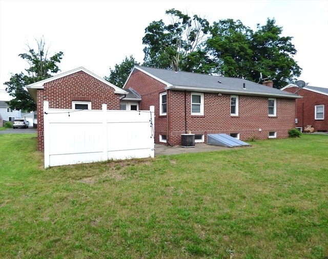 25 Williams St, Ludlow, MA 01056 - rear view of property with a lawn, brick siding, and cooling unit