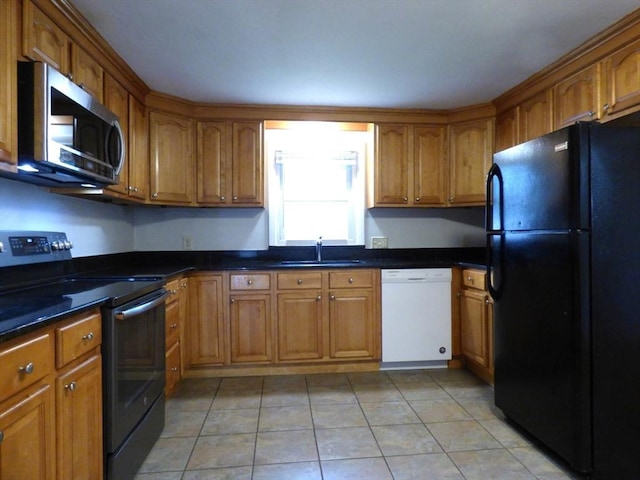 25 Williams St, Ludlow, MA 01056 - kitchen with freestanding refrigerator, dishwasher, electric range, stainless steel microwave, and brown cabinets