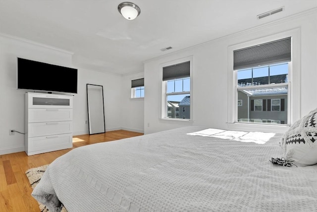 bedroom with hardwood / wood-style floors