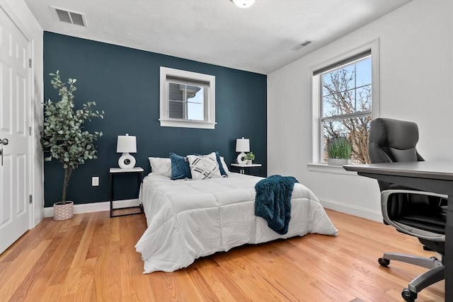 bedroom featuring light wood-type flooring