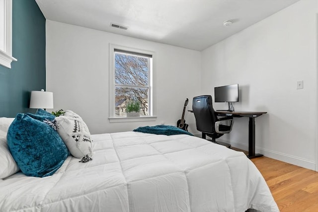 bedroom featuring hardwood / wood-style flooring