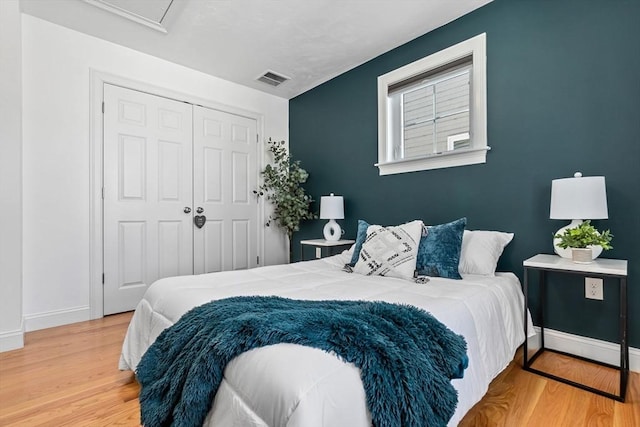 bedroom featuring a closet and hardwood / wood-style floors