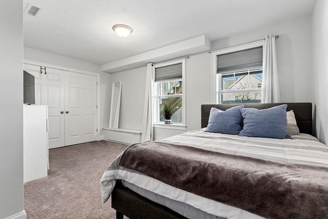 bedroom with carpet floors and a closet