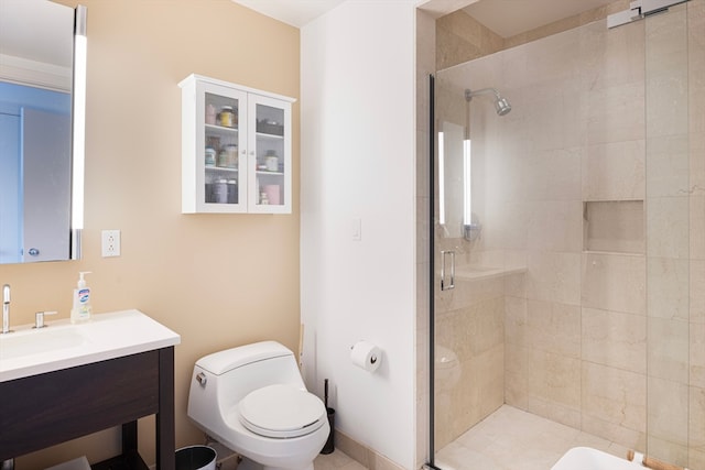 bathroom with vanity, a shower with shower door, and toilet