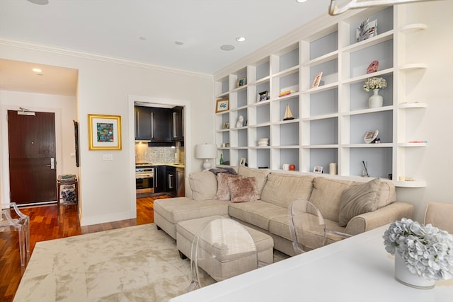 living room featuring hardwood / wood-style flooring and ornamental molding