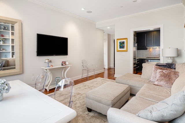 living room featuring hardwood / wood-style floors and ornamental molding