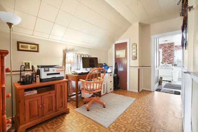 office space with vaulted ceiling