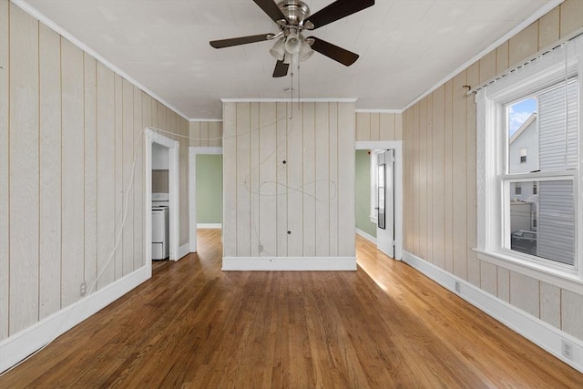 27 Cook St, Fall River, MA 02724 - unfurnished room with ornamental molding, wood finished floors, ceiling fan, and wooden walls