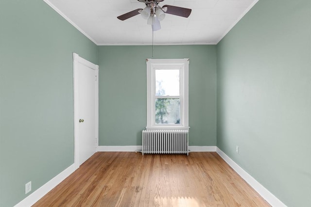 27 Cook St, Fall River, MA 02724 - empty room with radiator, crown molding, wood finished floors, and a ceiling fan