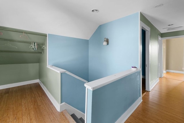 27 Cook St, Fall River, MA 02724 - corridor with an upstairs landing, wood finished floors, and vaulted ceiling