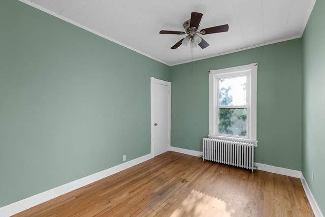 27 Cook St, Fall River, MA 02724 - unfurnished room with radiator heating unit, crown molding, wood-type flooring, and a ceiling fan