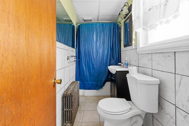 27 Cook St, Fall River, MA 02724 - bathroom featuring radiator, tile patterned flooring, shower / bath combo, a drop ceiling, and tile walls